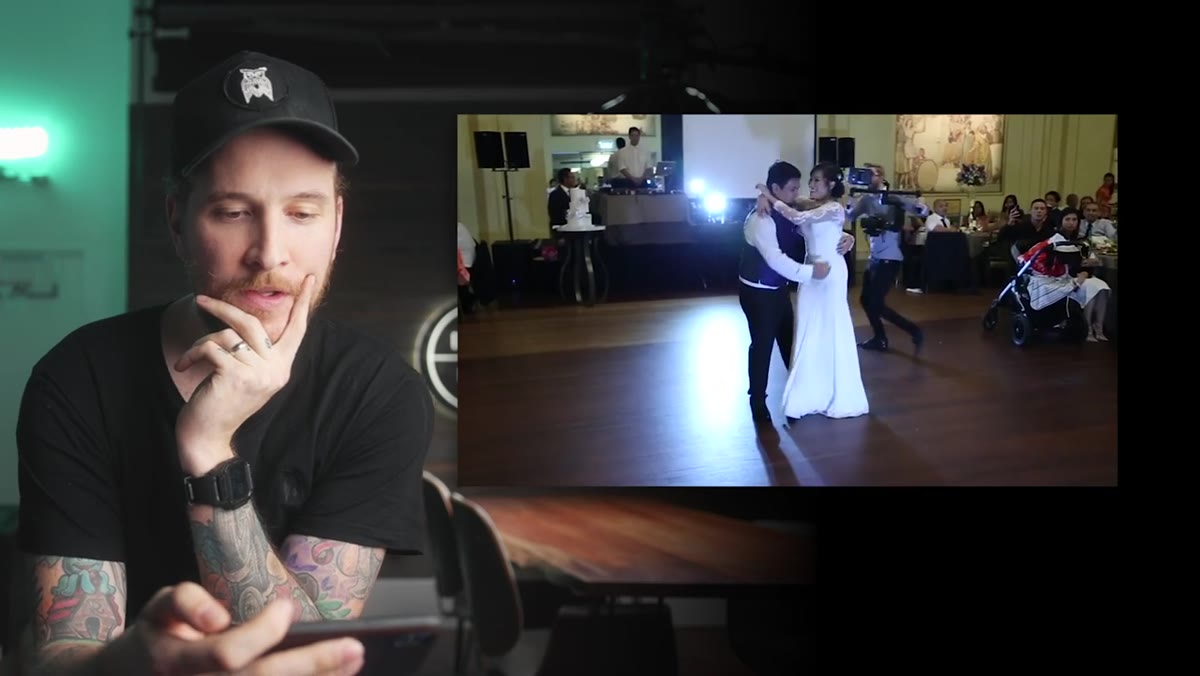 Father lifting daughter during wedding dance, nearly dropping her