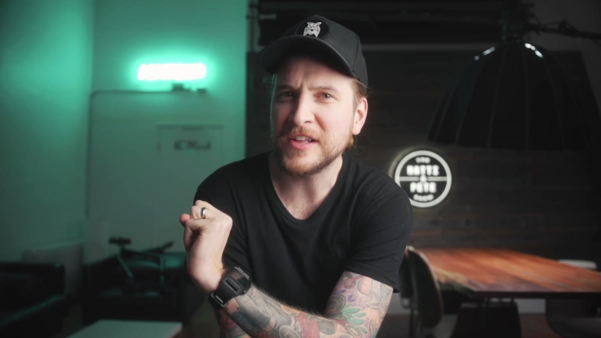 Photographer demonstrating lens flip technique on camera