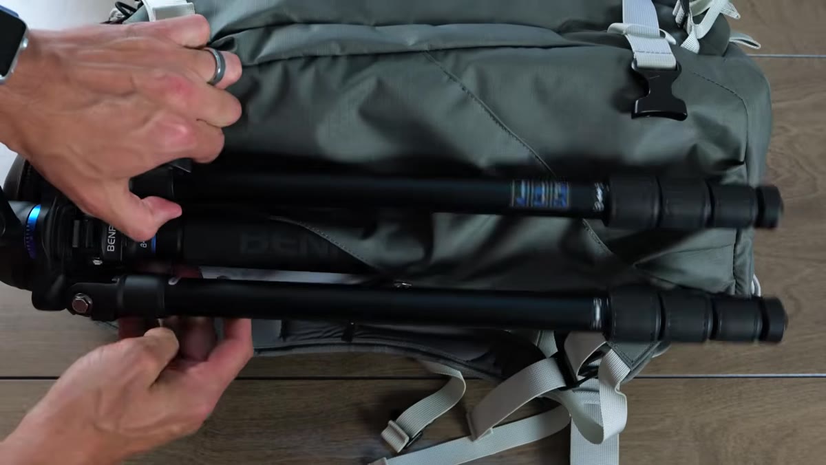 Adjustable internal dividers being repositioned inside the bag