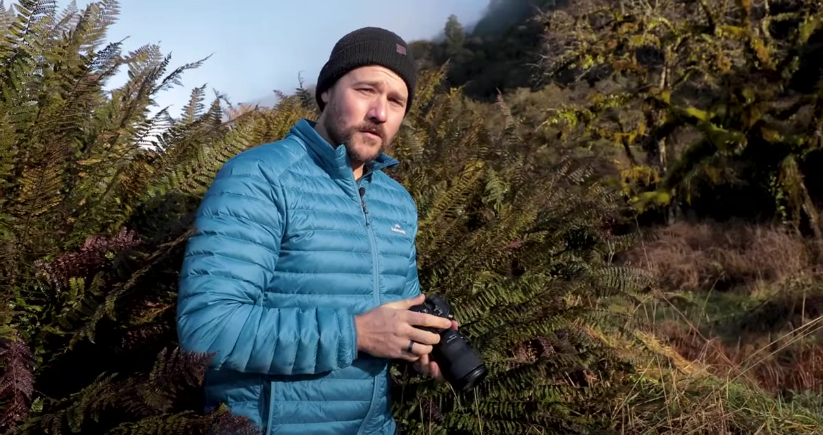 Photographer reviewing image on camera LCD, zooming in to check sharpness