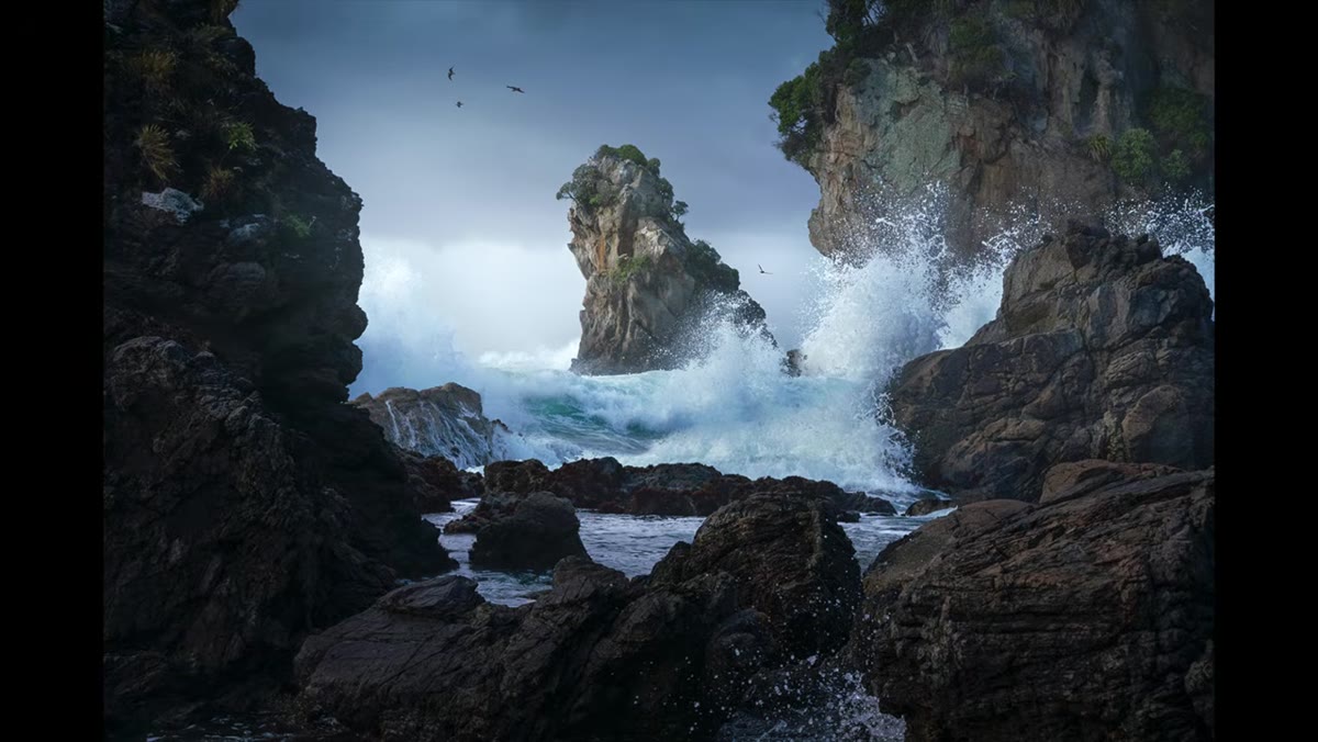 Cool gray clouds above blue-toned ocean water