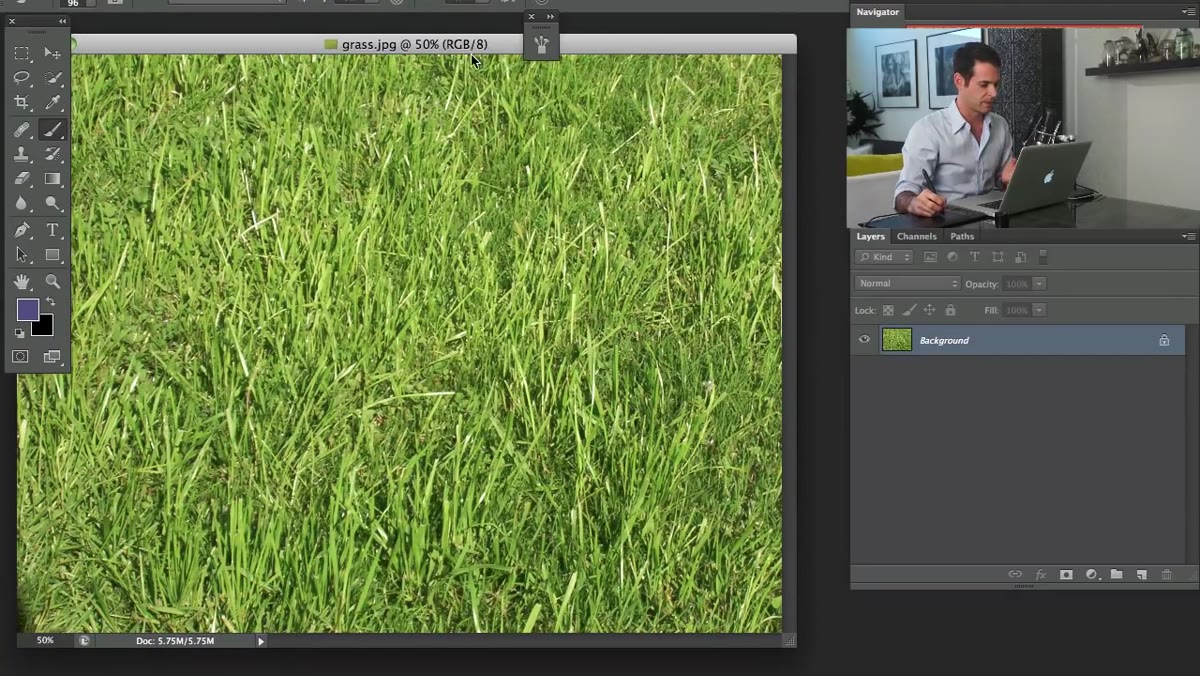 Grass photo being dragged into the working Photoshop document