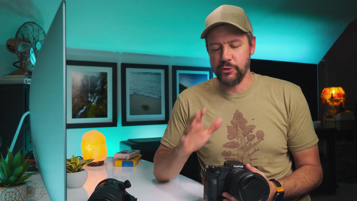 Photographer reviewing images on laptop screen