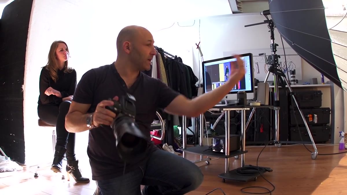 Model skipping into frame, photographer calling direction during movement