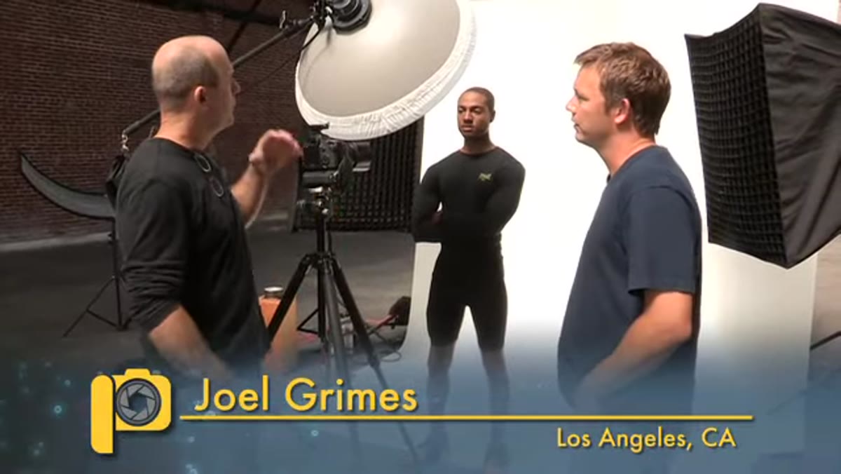 Beauty dish overhead and two rear softboxes visible on set