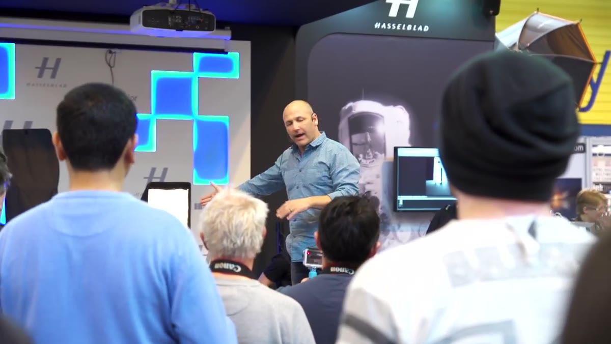 Photographer explaining background-to-foreground lighting build