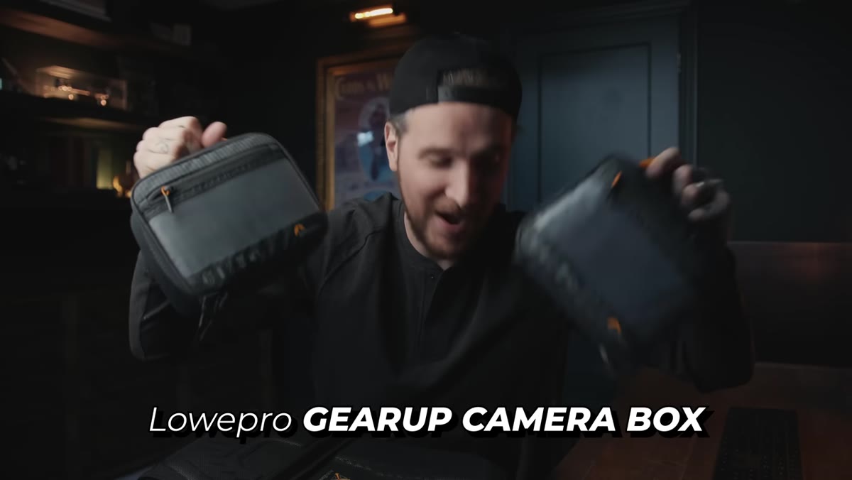 Two Lowepro branded pouches sitting inside the bag compartments
