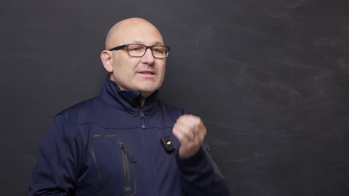 Presenter explaining lens choices and system compatibility