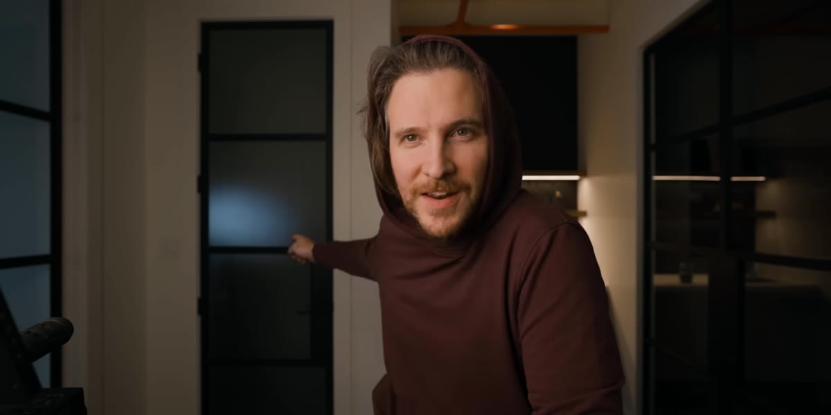 Peter holding the 1DX Mark II, visibly conflicted
