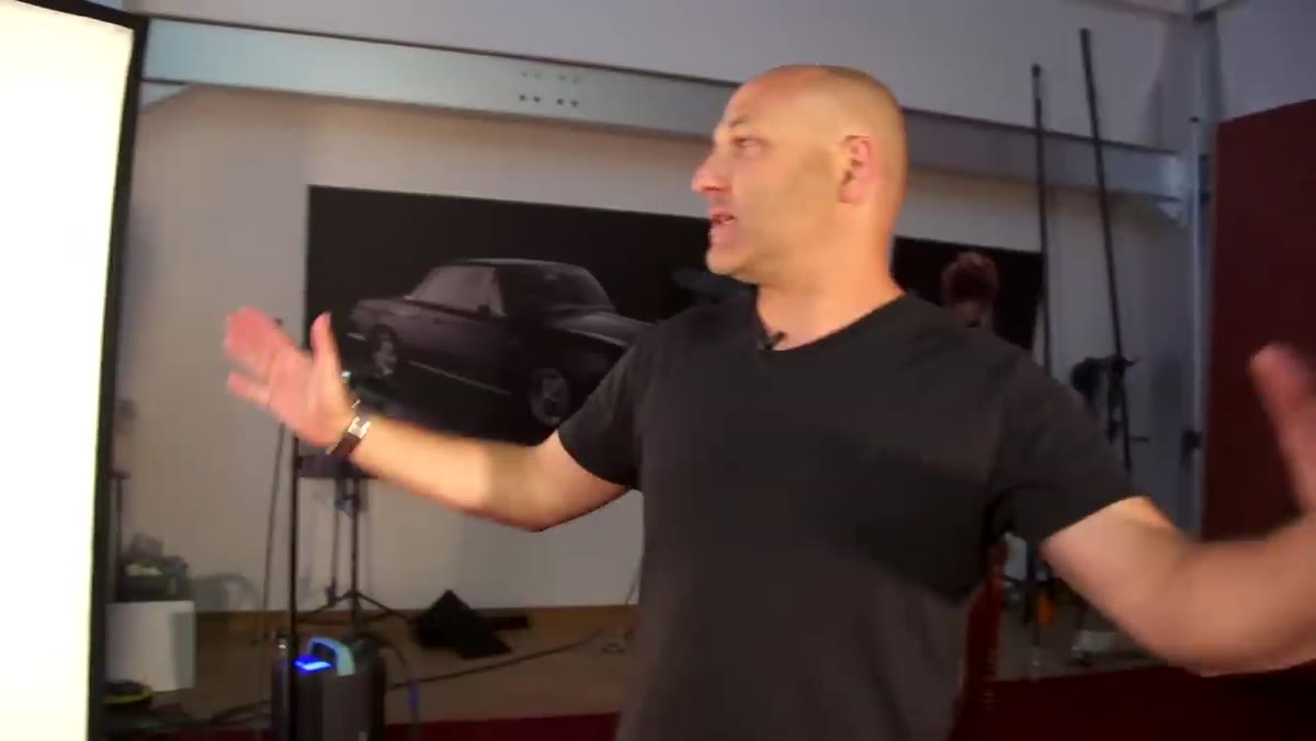 Carl explaining the PAR 88 key light position above the set