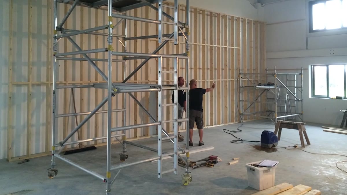 Initial timber stud framework being erected in studio space