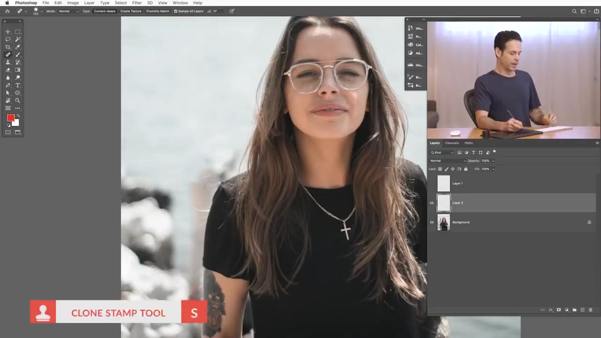 Clone Stamp tool active, painting near subject&rsquo;s shirt edge