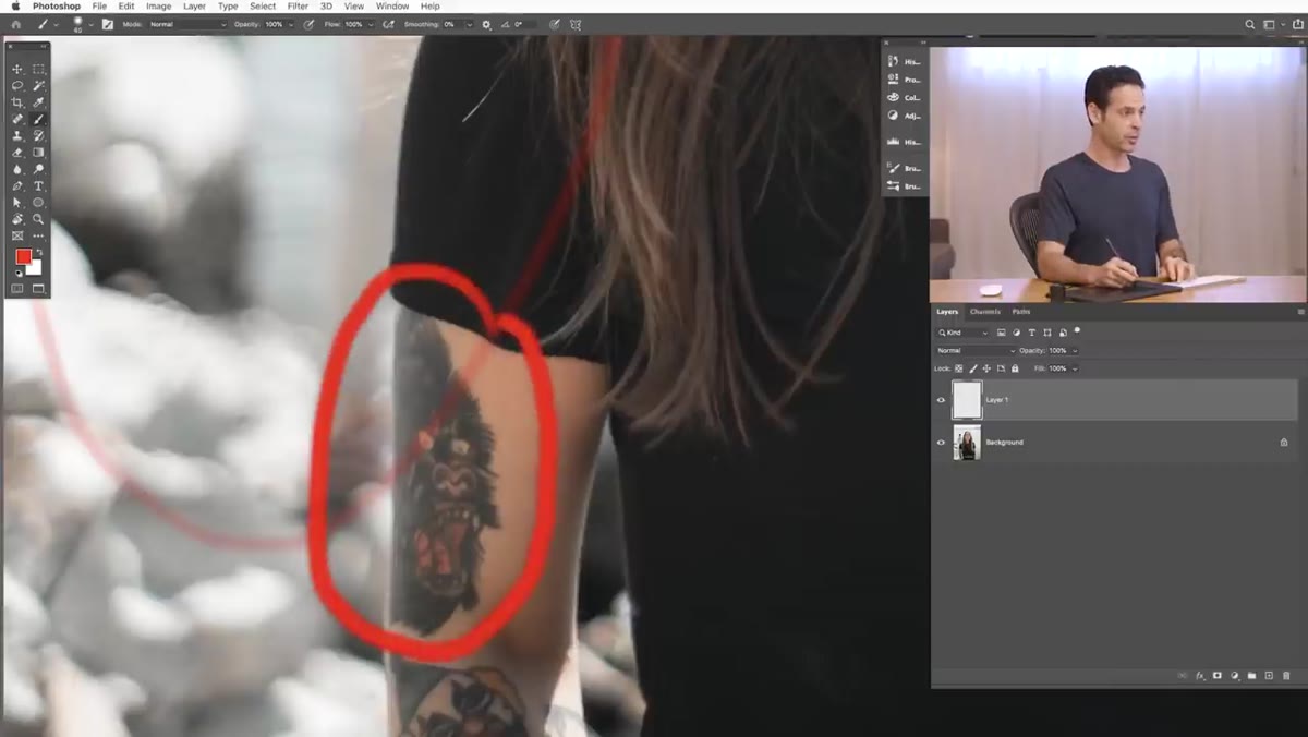 Close-up view of tattoo area on subject&rsquo;s arm being painted over