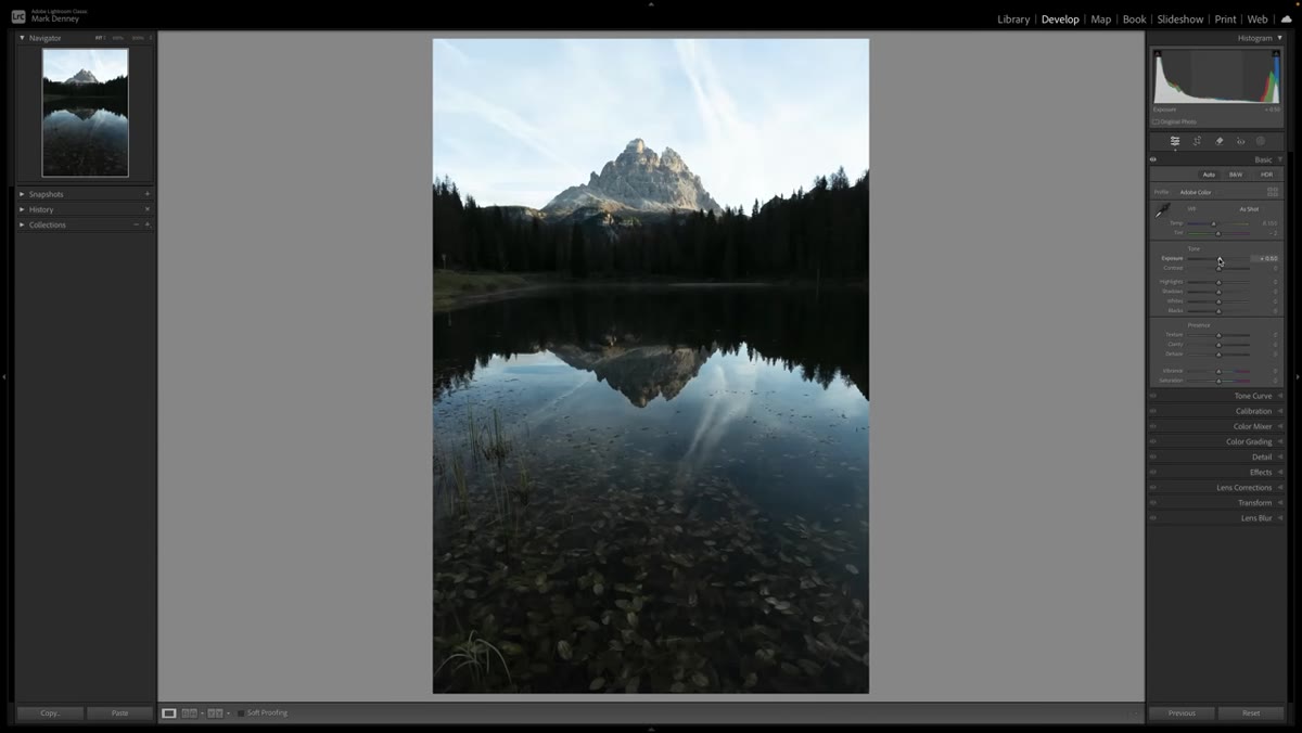 Exposure slider being increased on a slightly underexposed mountain scene