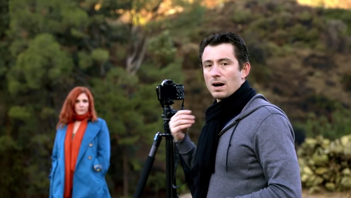 Photographer interacting with subject during portrait session