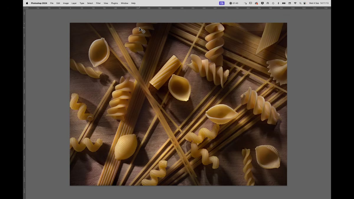Kyle explaining light painting technique with second pasta arrangement