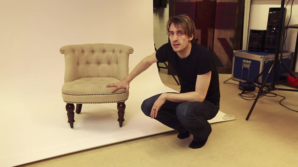 Chair positioned on white floor against white wall
