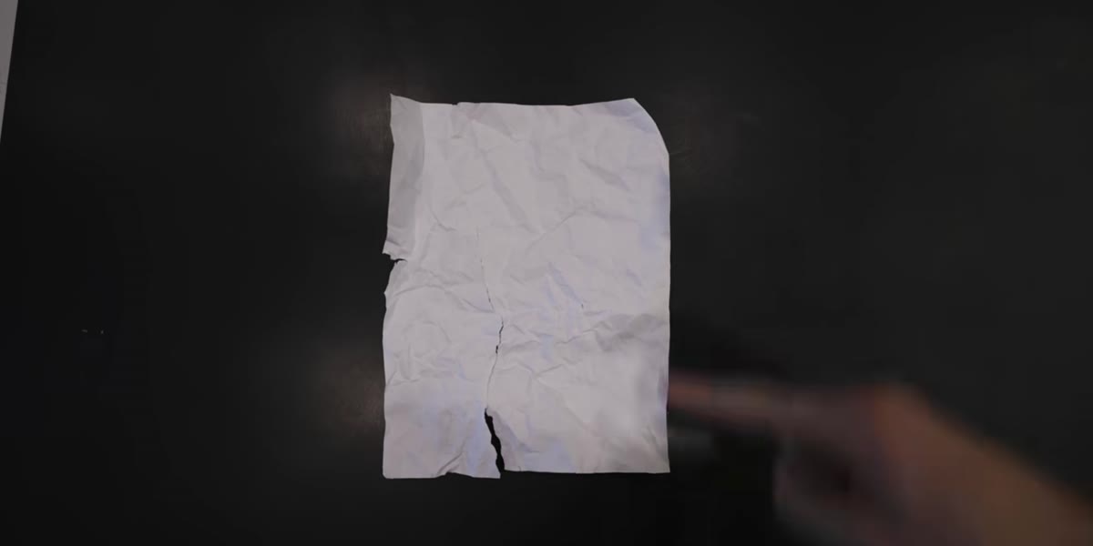 Coffee or tea being applied to printed photo