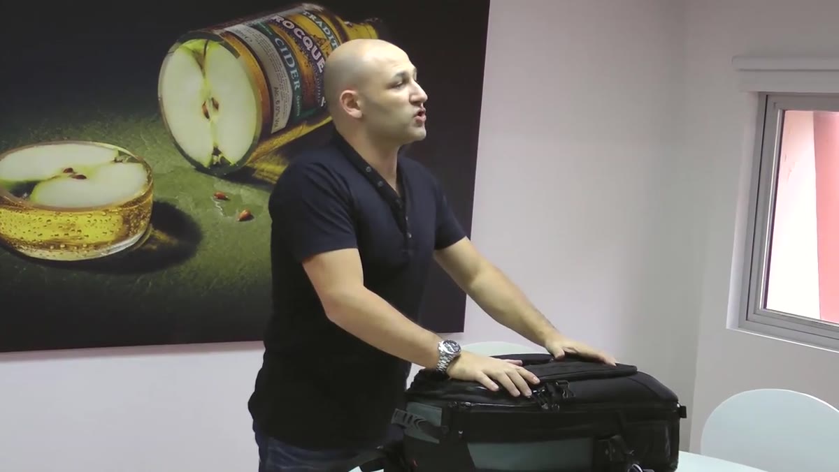 Close-up of the Lowepro bag being measured against airline carry-on dimensions