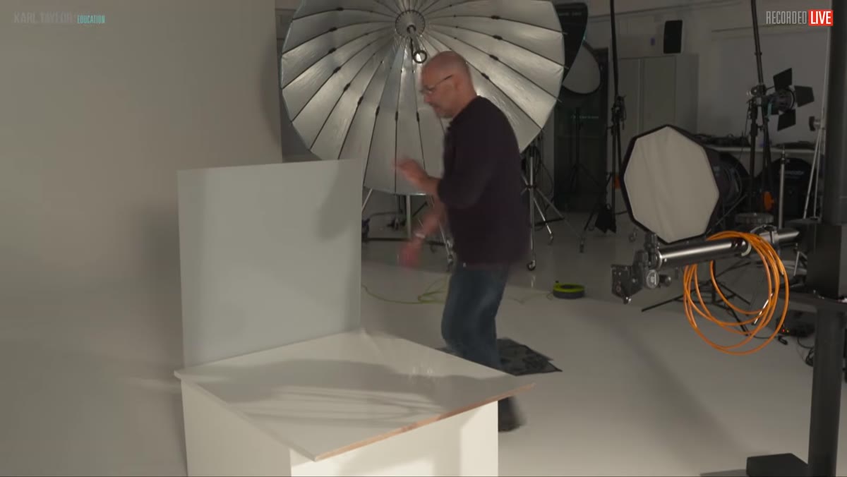 Polished metal sheet reflecting camera and crew