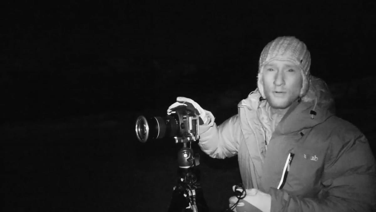 Camera controls being adjusted, manual focus indicated