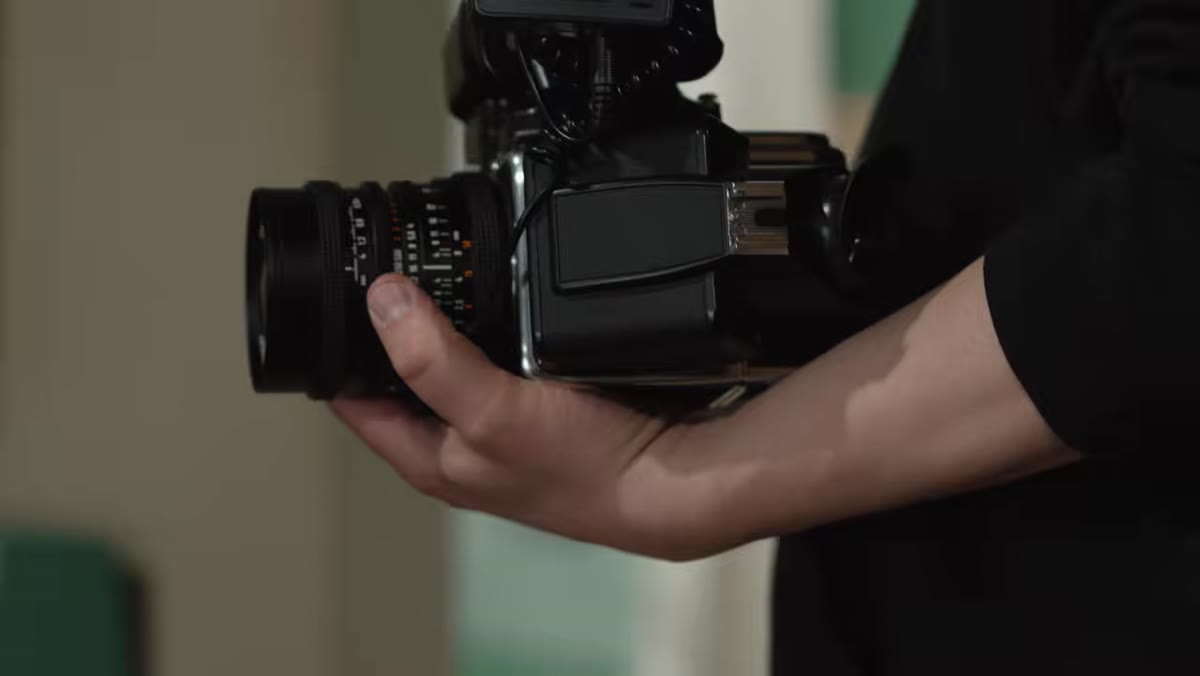 Behind-the-scenes footage of strobe lighting setup on location