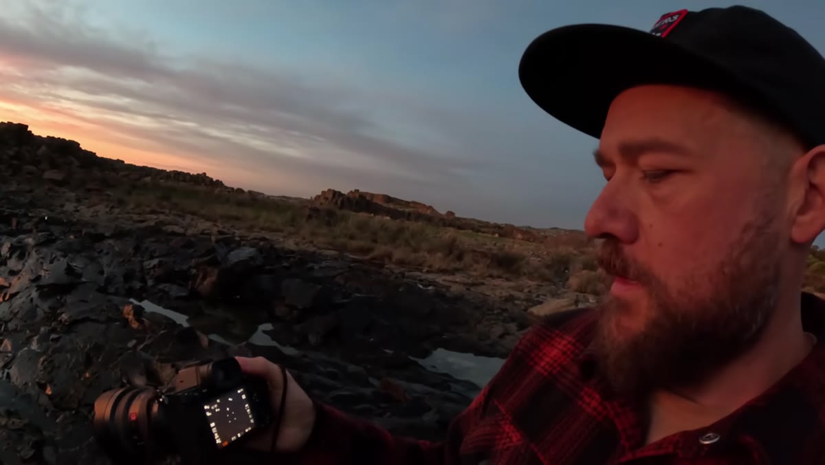 William dialing in shutter speed and aperture settings