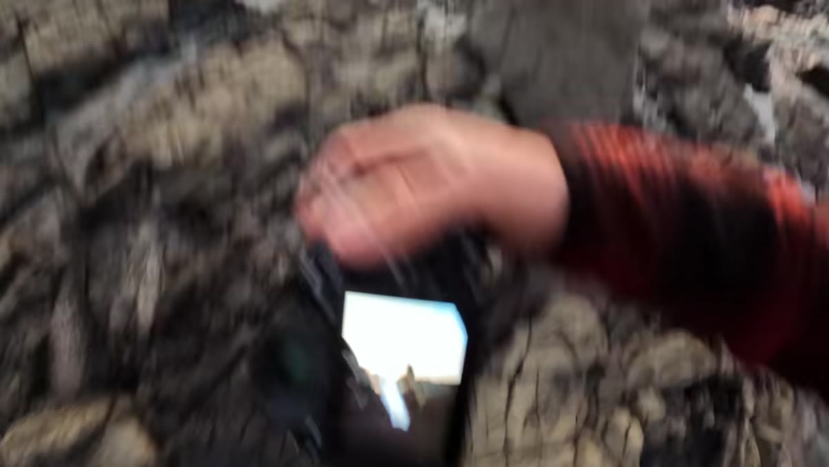 William reviewing test shots on camera screen