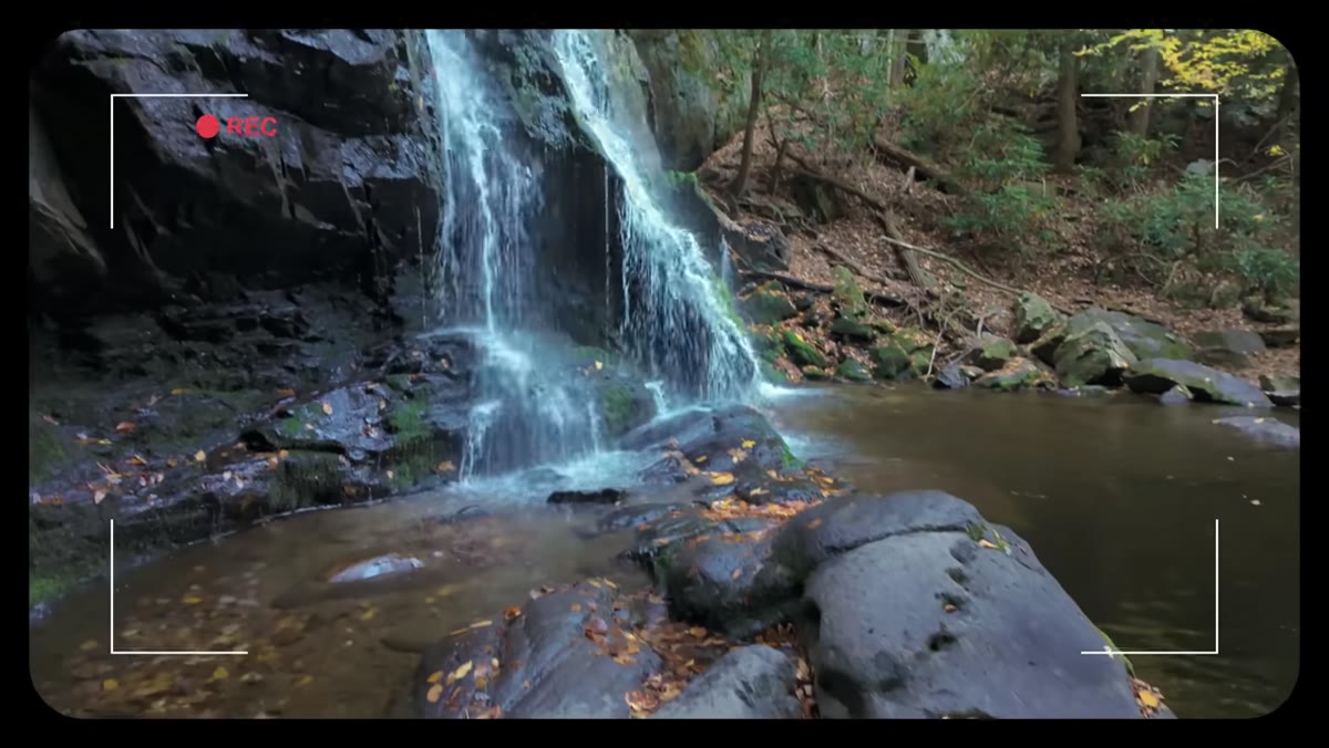 Mark holding phone up to preview composition at the waterfall
