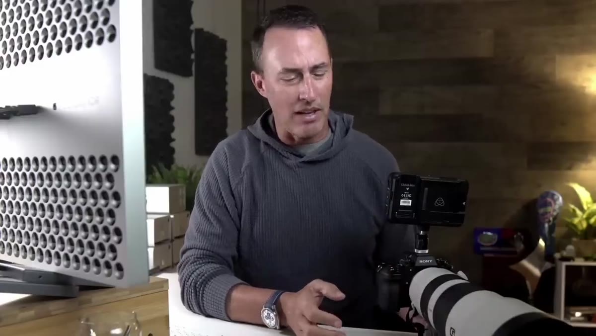 Sony 400-800mm lens visible on camera body