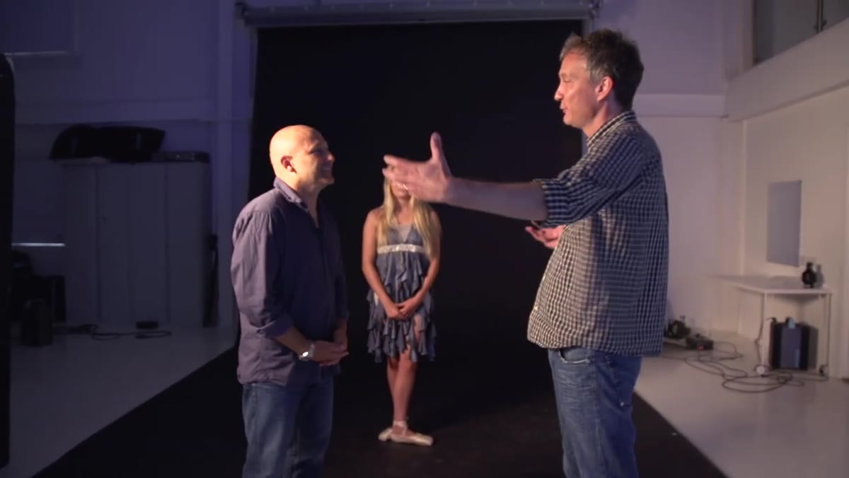 Presenter explaining the two-light concept in studio