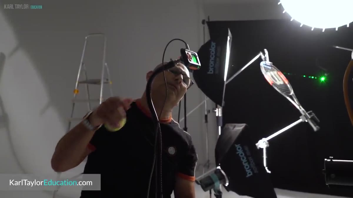 Laser pointer aimed at the trigger sensor on a tennis shoot setup