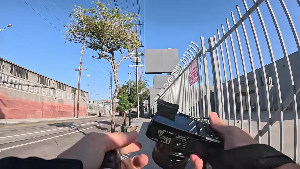 Pierre holding the RX1R III, examining grip in hand