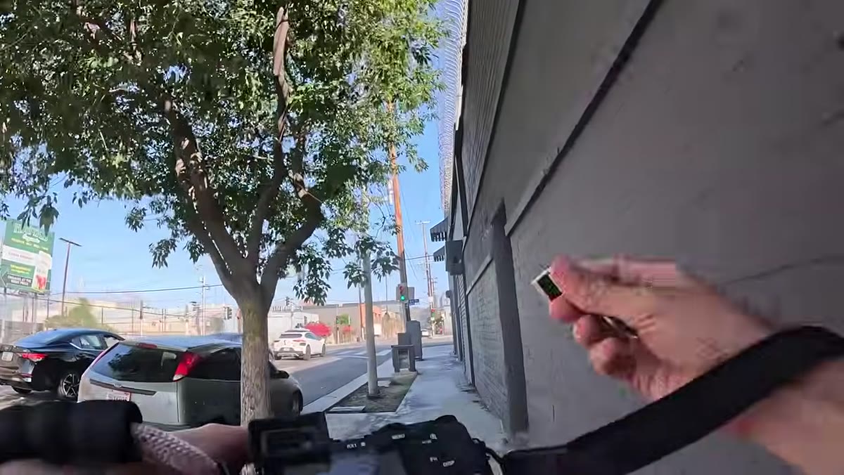Thumb grip attachment visible on top of camera body