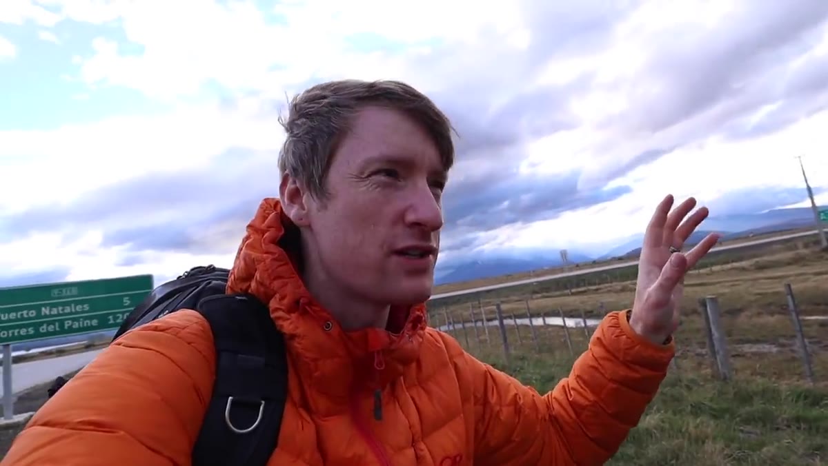 Thomas spotting a cliff face with dramatic storm light