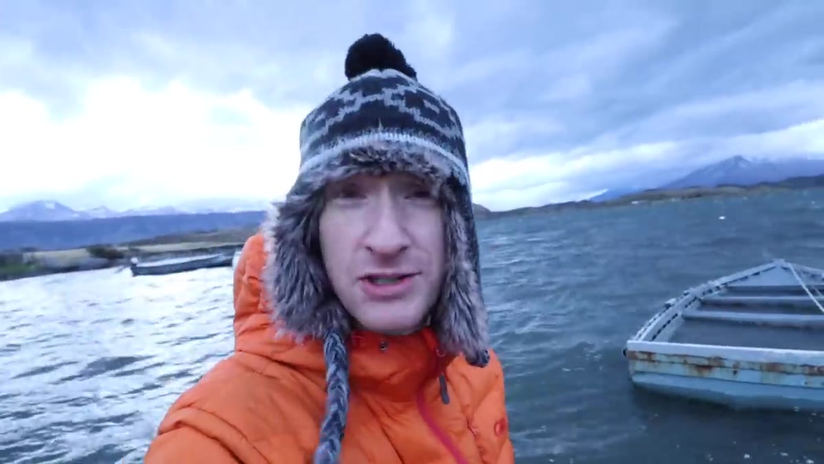 Heaton wading into cold water to shoot a submerged boat up close