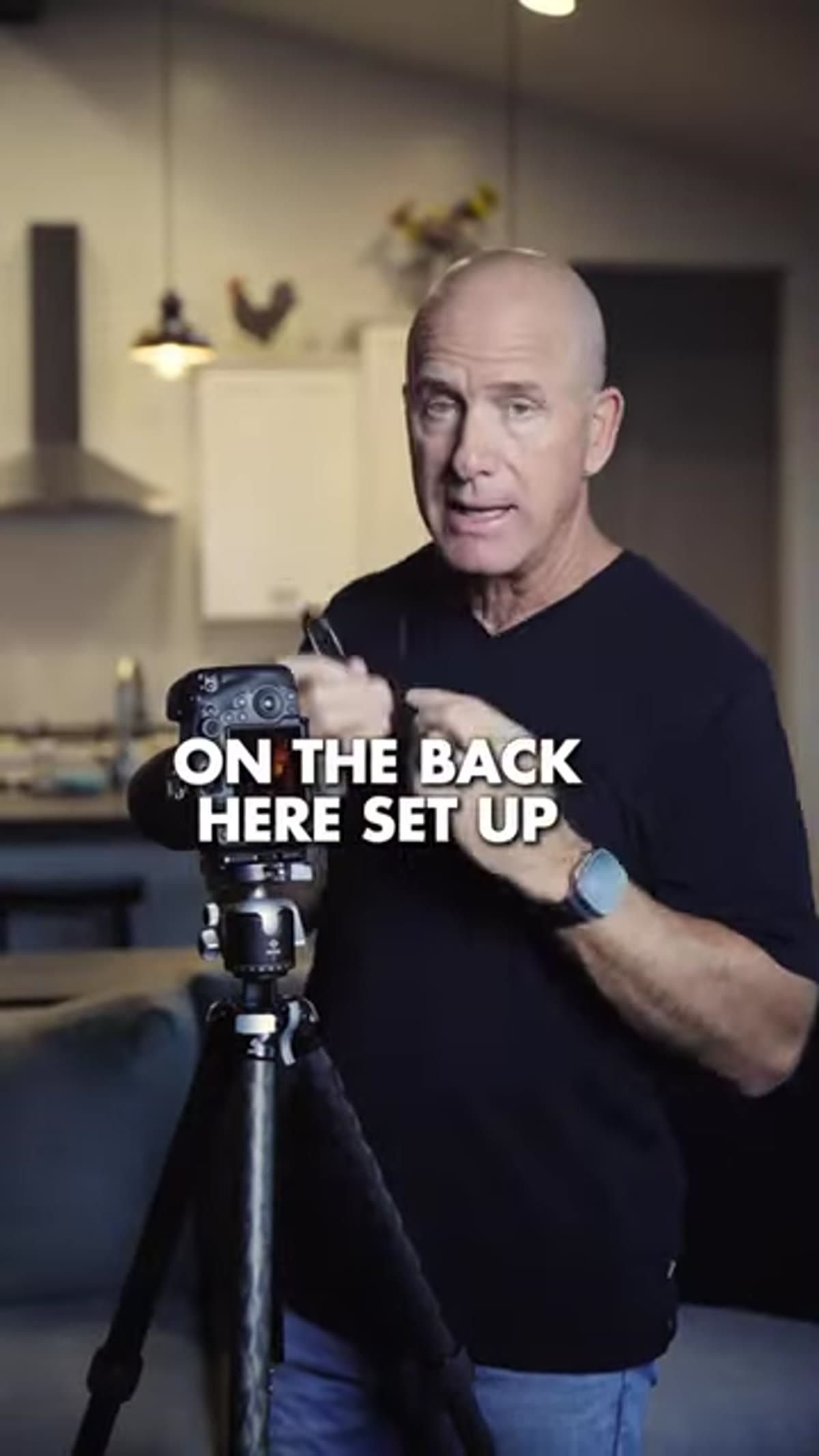 Touchscreen on camera back being tapped to focus and fire