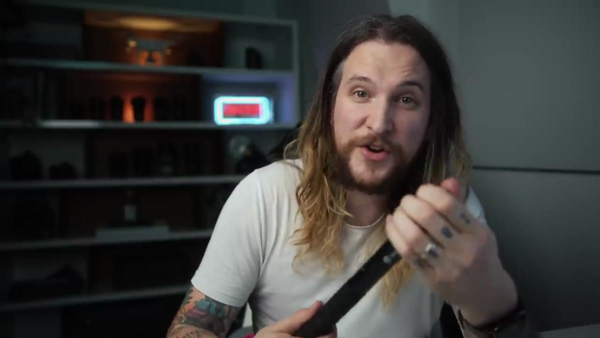 Selfie stick fully extended with camera mounted on top