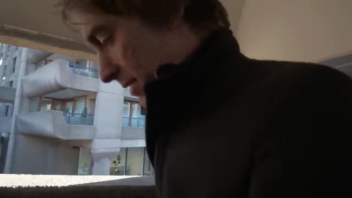 Tucker reviewing image showing figures without visible faces