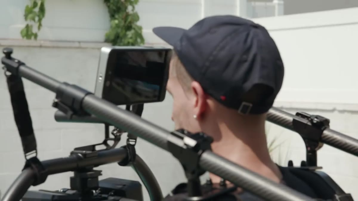 Director giving precise verbal direction to subject about movement and position