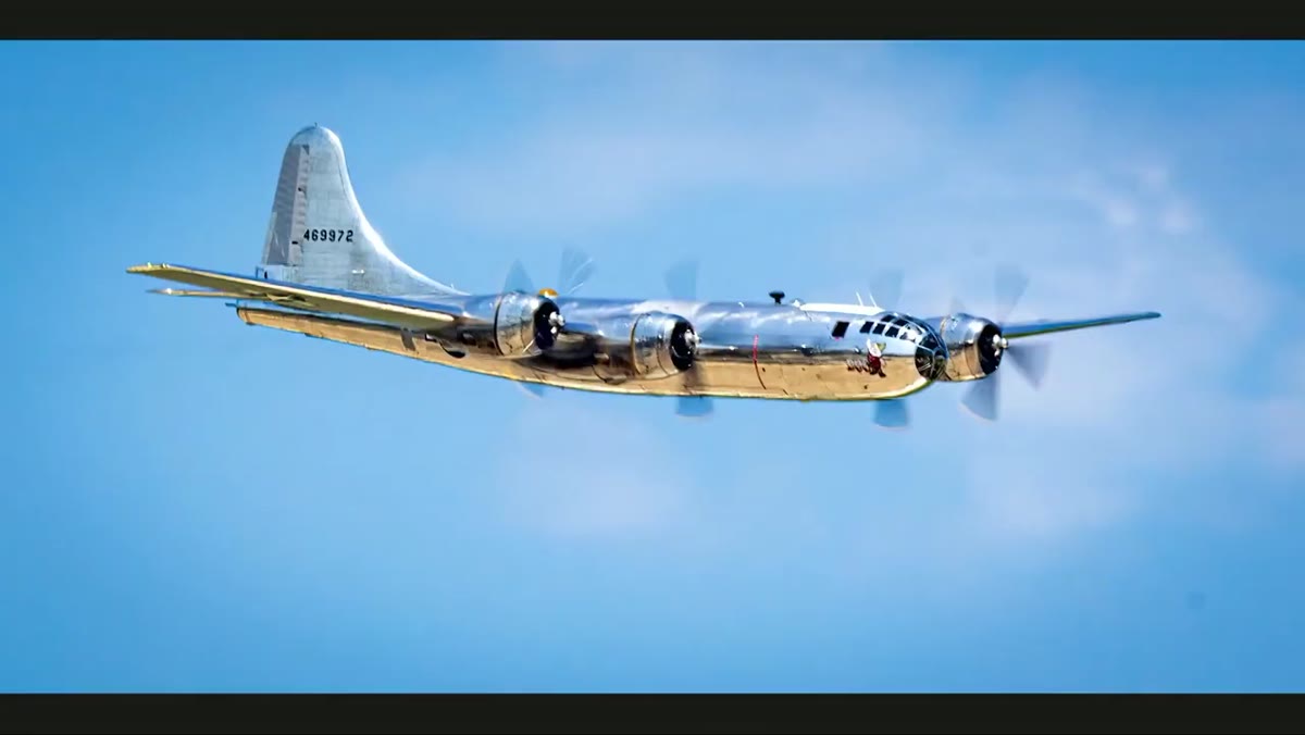 Zoomed-in view of a soft, out-of-focus airplane in flight