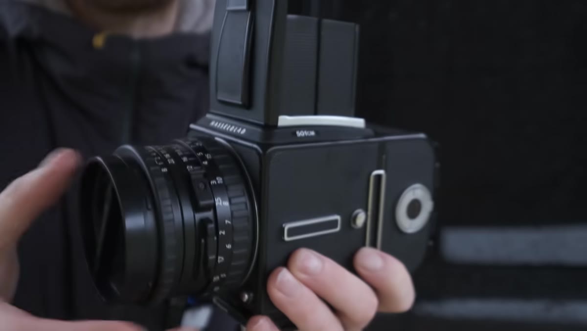 Heaton holding the Hasselblad 501CM and describing the square format