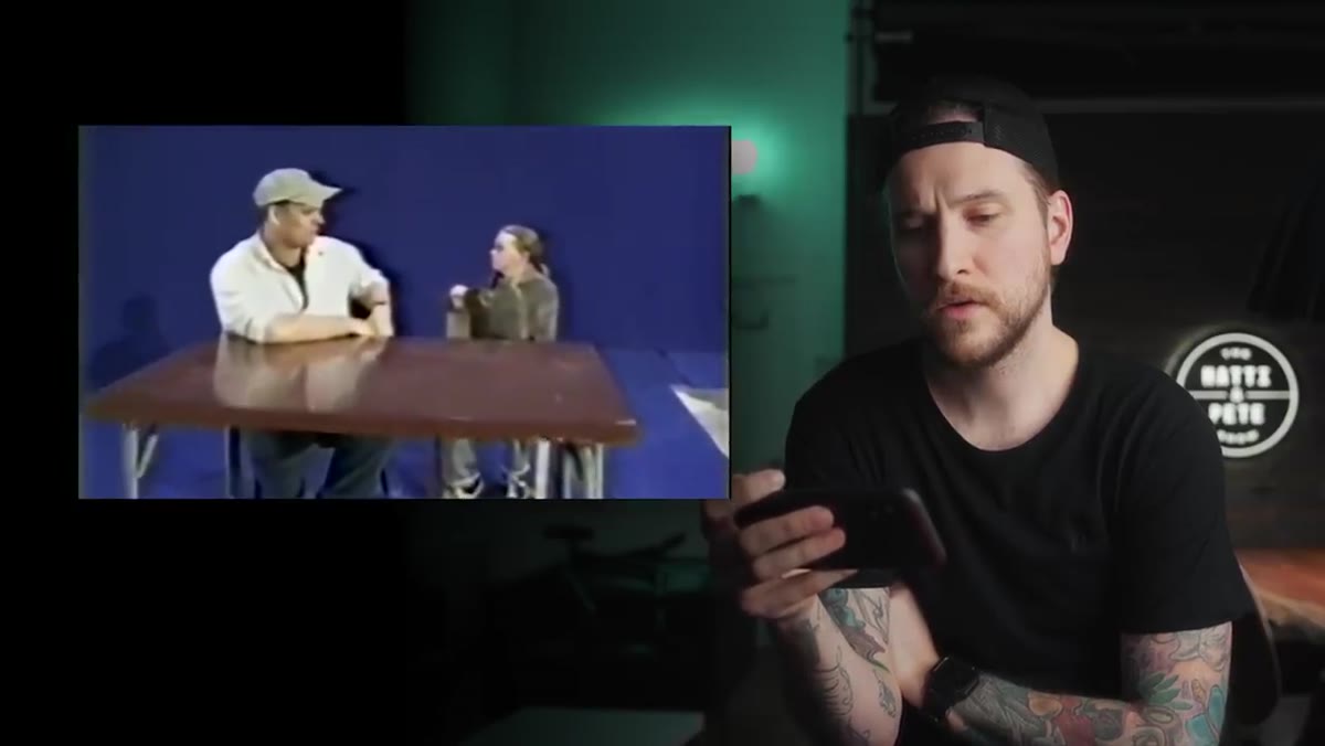 Ian McKellen seated at a miniature table on a separate dolly
