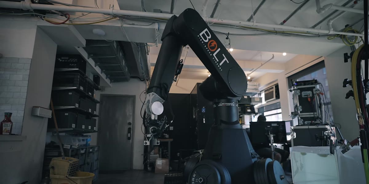 Bolt robot arm holding a Phantom 4K high-speed camera in studio