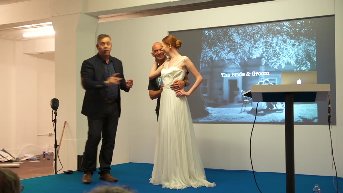 Photographer giving hand and posture direction to subject