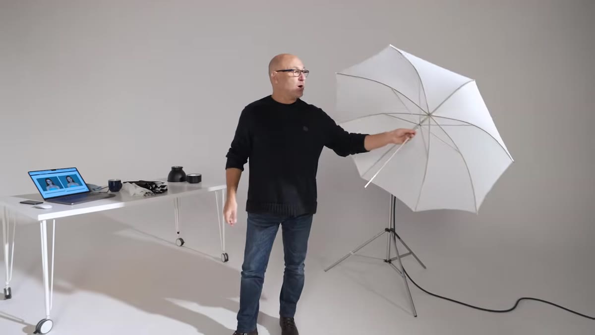 White translucent umbrella held open showing fabric diffusion material
