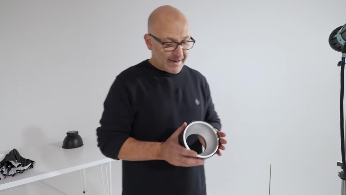 Wide reflector being attached to strobe, shorter and stubbier than standard