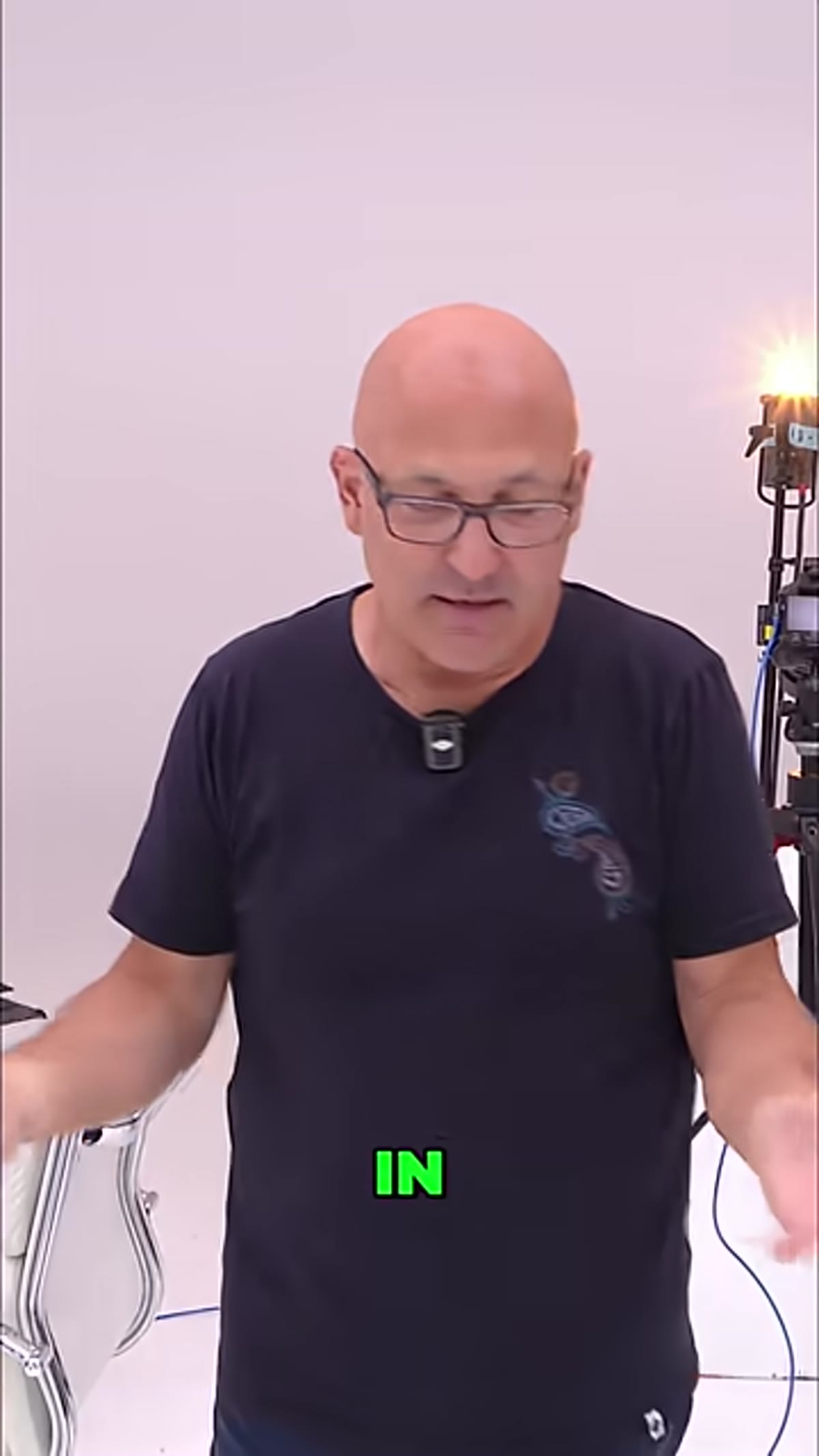 Presenter describing a dome-shaped all-white seamless studio